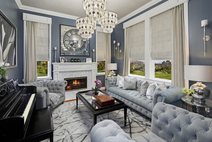Living room with fireplace, sofa, and piano