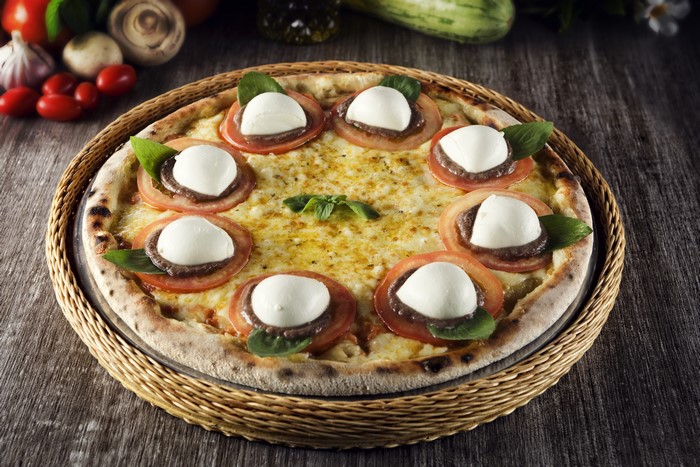 Pizza with tomatoes and mozzarella