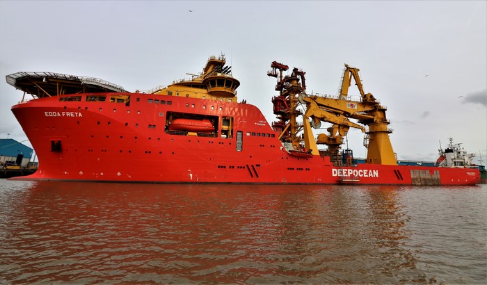 The red ship Edda Freya docked at sea