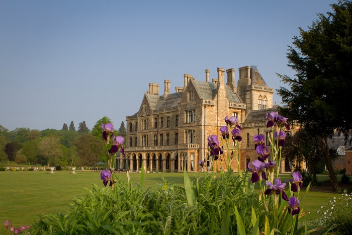 Walton Hall Mansion with Irises and Lawn in the UK