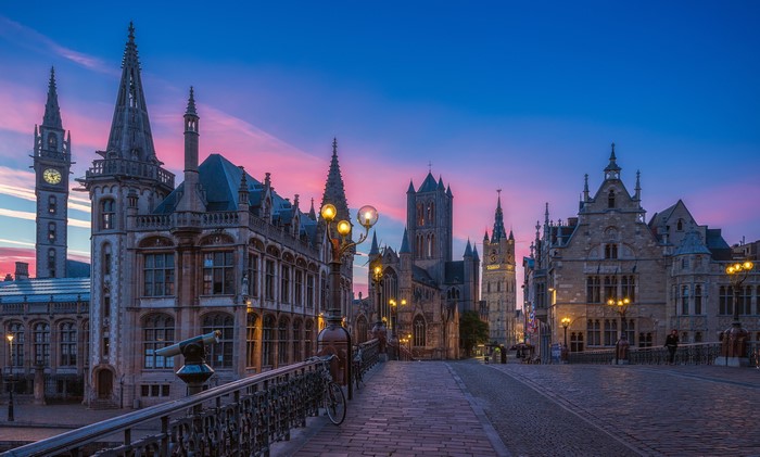 Ghent Belgium street with historic buildings at dusk