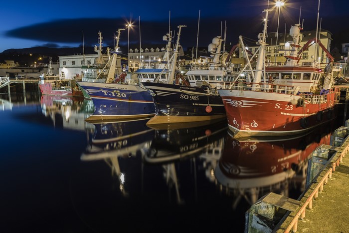 Fishing boats docked at Killybegs harbour, Ireland at night