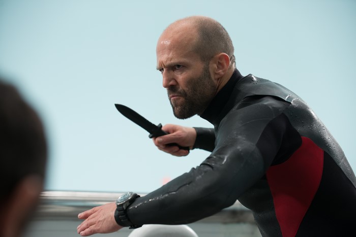 Jason Statham as Mechanic from Mechanic 2 holding a knife
