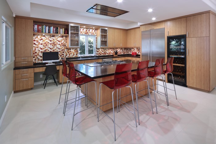 Modern kitchen with island and red chairs