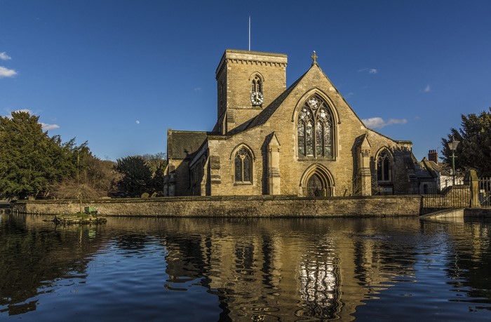 St Helens Church Welton East Yorkshire reflected in water