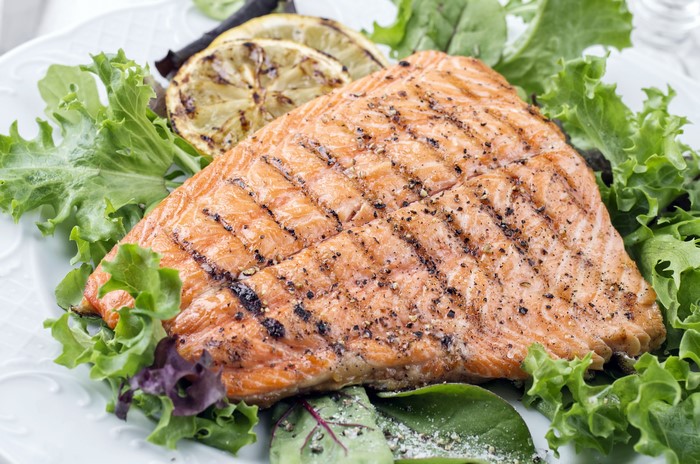 Grilled Salmon Fillet with Lemon Slices and Salad
