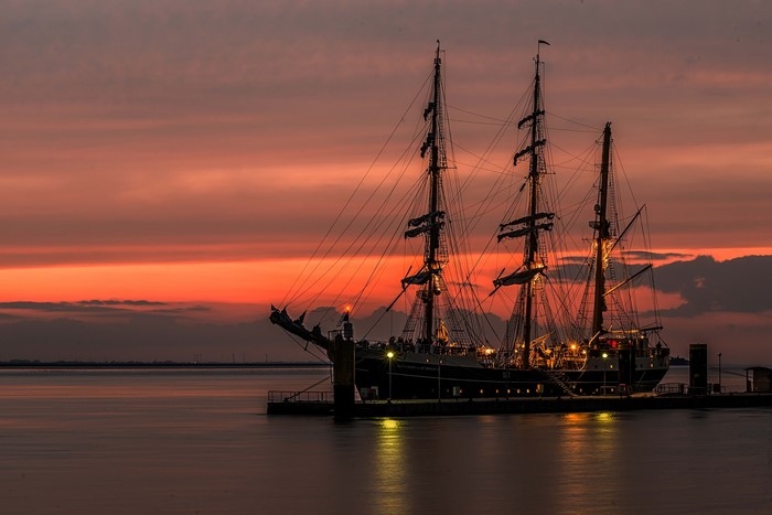 Tall Ship at Dock During Sunset