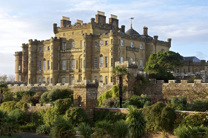 Culzean Castle Scotland with stone fence and shrubs