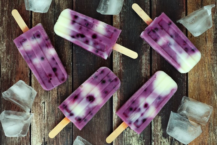 Blueberry and Yogurt Popsicles on Wood