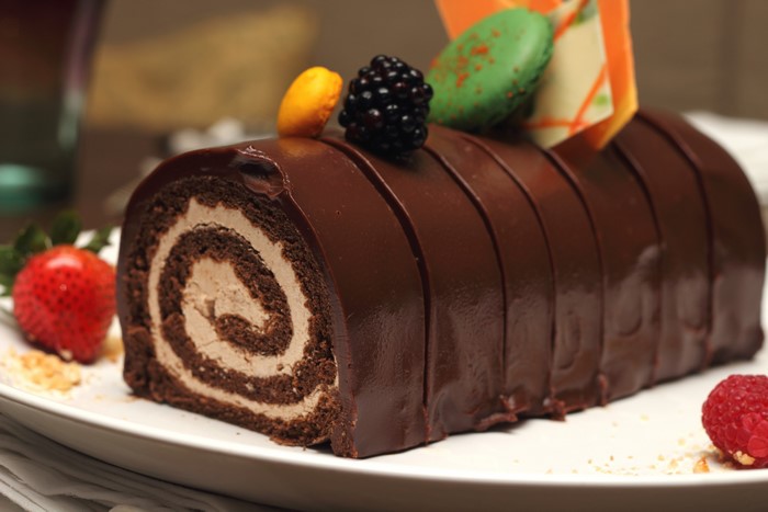 Chocolate Swiss Roll Cake with Berries and Macarons