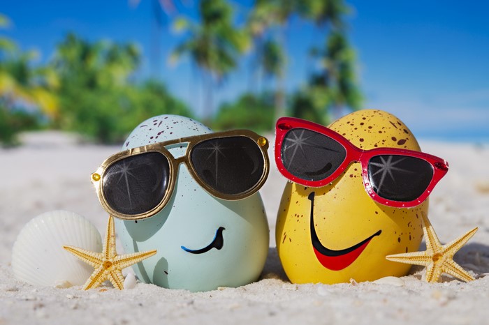 Summer Eggs with Sunglasses on a Beach