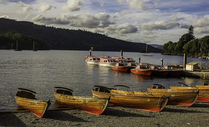 Boats docked on the shore of Lake Windermere, England