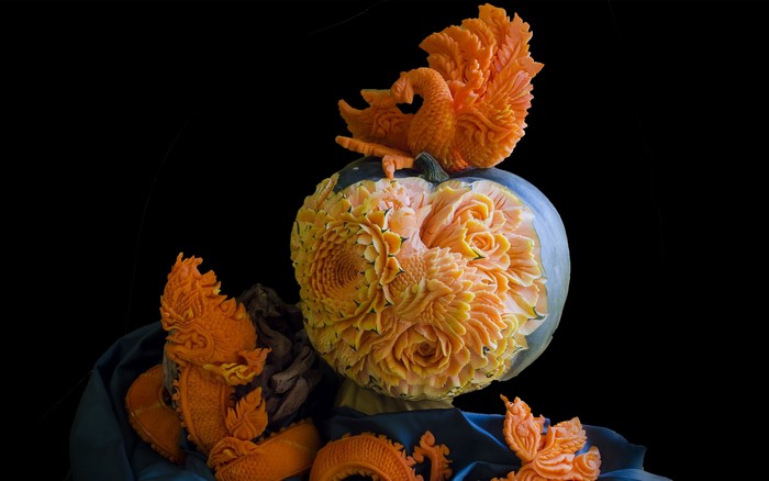 Pumpkin carved with flowers and a swan