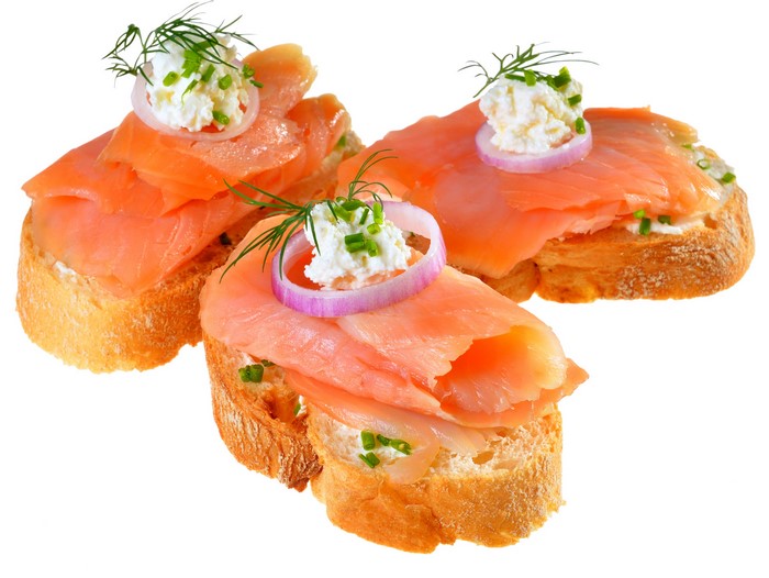 Smoked salmon and cream cheese canapés on baguette slices
