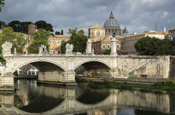 Rome, Italy: Bridge over Tiber River with St. Peter's Basilica