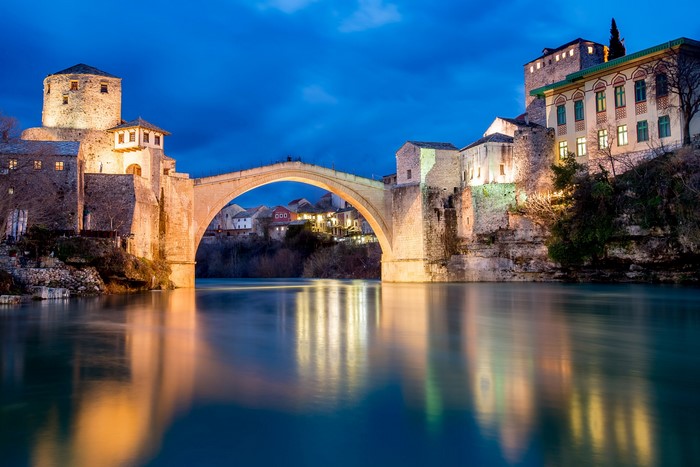 Stari Most bridge over Neretva River in Mostar at dusk