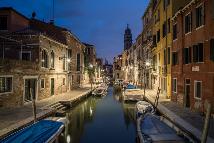 Venice Canal at Night with Boats and Buildings