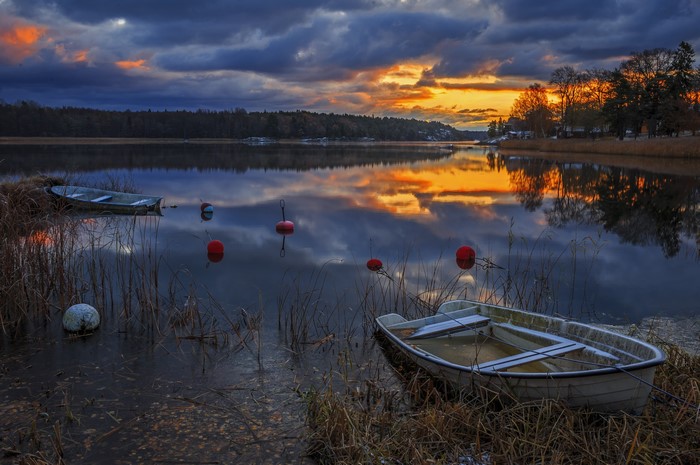 4K Sweden Sunset Over River with Boats