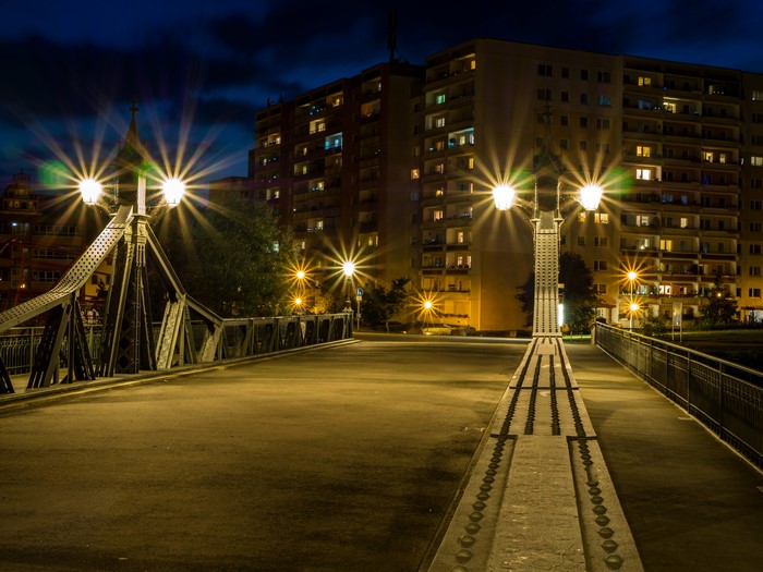 Bridge at night with street lights and apartment buildings in Zwickau, Germany
