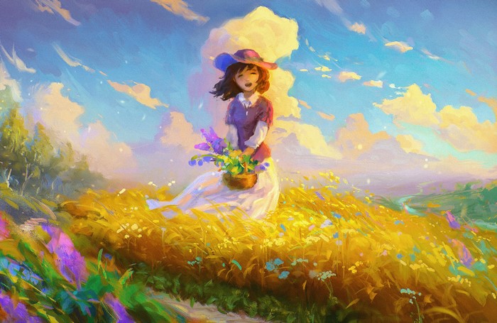 Girl in a hat in a field of flowers