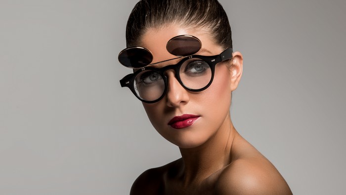 Woman with flip-up sunglasses and glasses