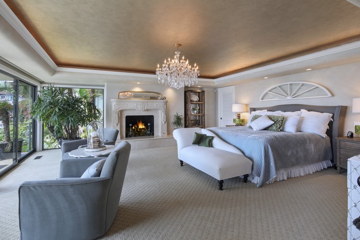 Luxurious Bedroom with Fireplace and Chandelier