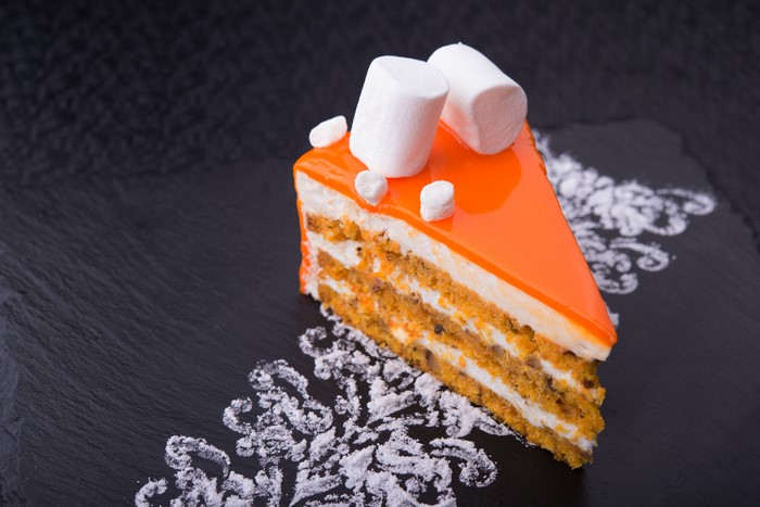 Slice of orange cake with marshmallows