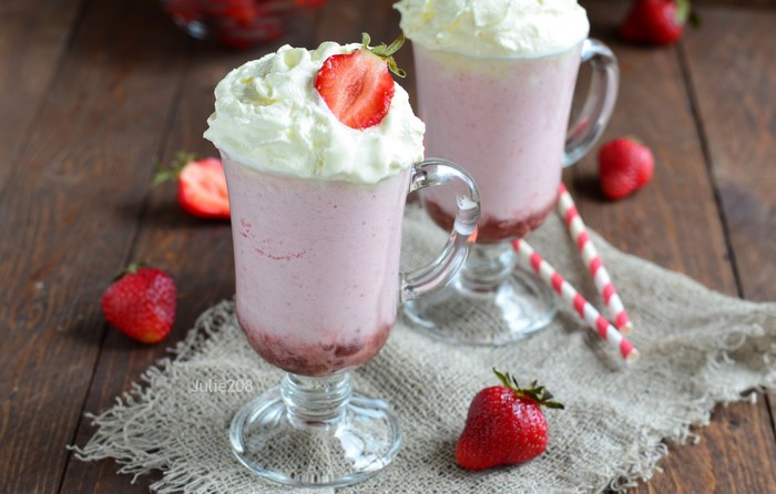 Strawberry milkshakes with whipped cream and strawberries