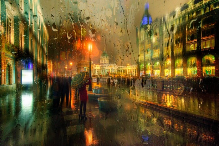 Rainy night in St. Petersburg with people and buildings