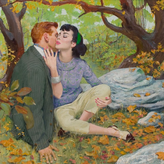 Couple kissing under a tree in autumn
