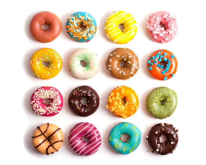 Assortment of colorful donuts on a white background