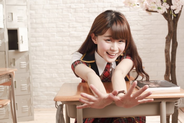 Asian schoolgirl at a desk