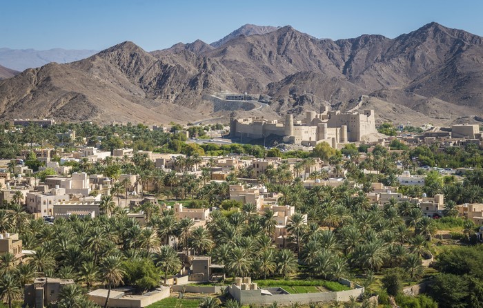 Bahla Fort Oman with Mountains and Houses