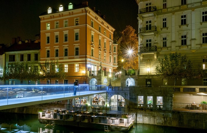 Night view of Ljubljana with a modern bridge and buildings