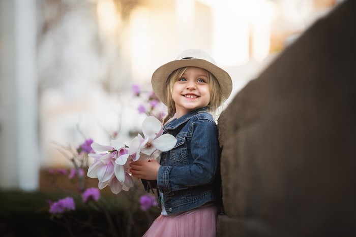 Girl in Hat and Jacket with Flowers