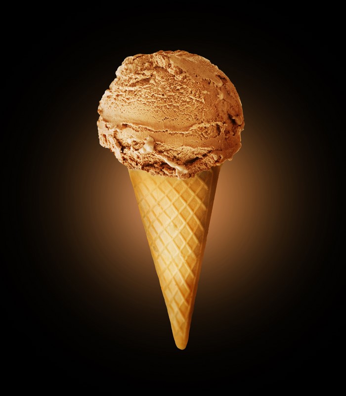 Chocolate ice cream cone on a dark background