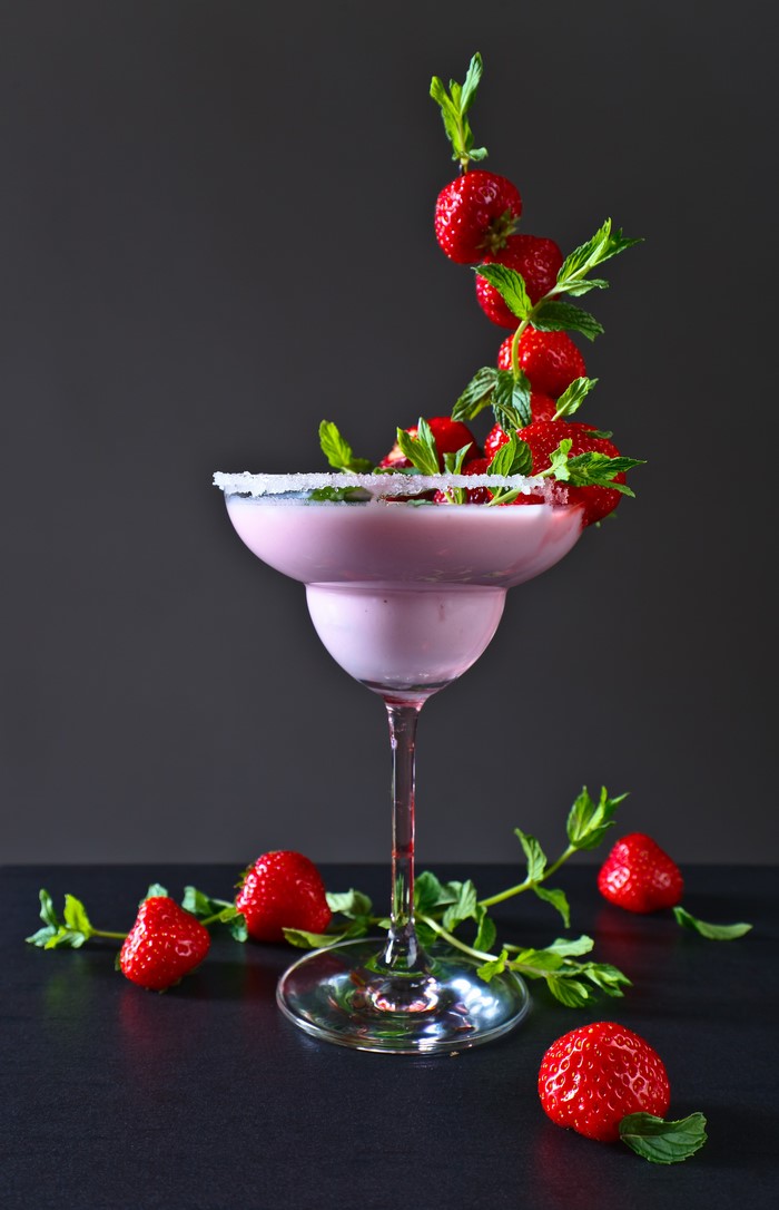 Strawberry cocktail with mint and sugar rim