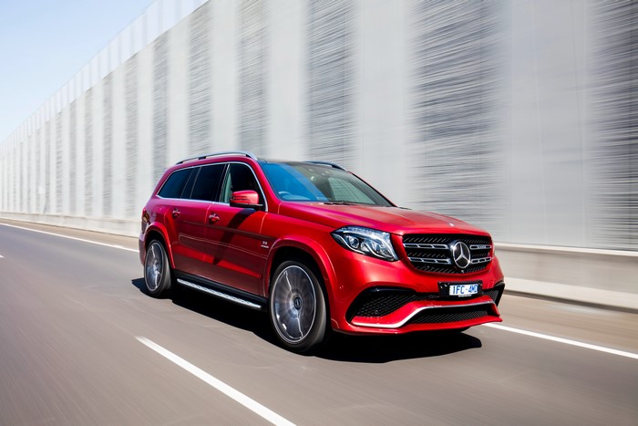 Red Mercedes-Benz AMG X166 GLS-Class on a highway