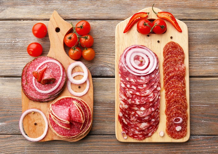 Sausage, Tomatoes, and Onions on Cutting Boards