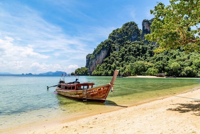 Longtail boat on a tropical beach in Thailand