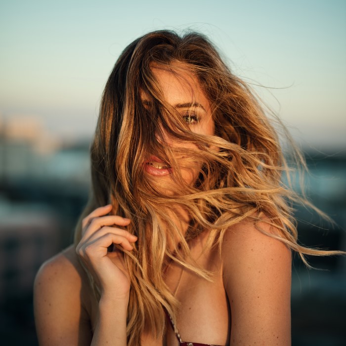 Woman with hair blowing in the wind
