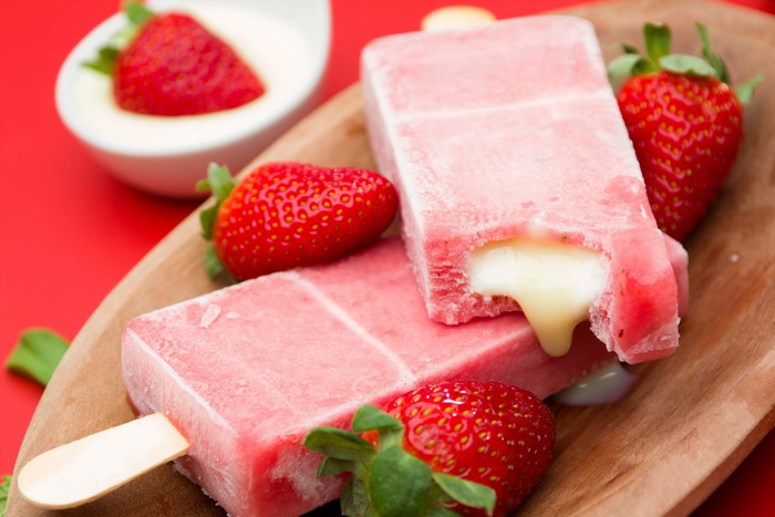 Strawberry ice cream bars with cream filling and strawberries