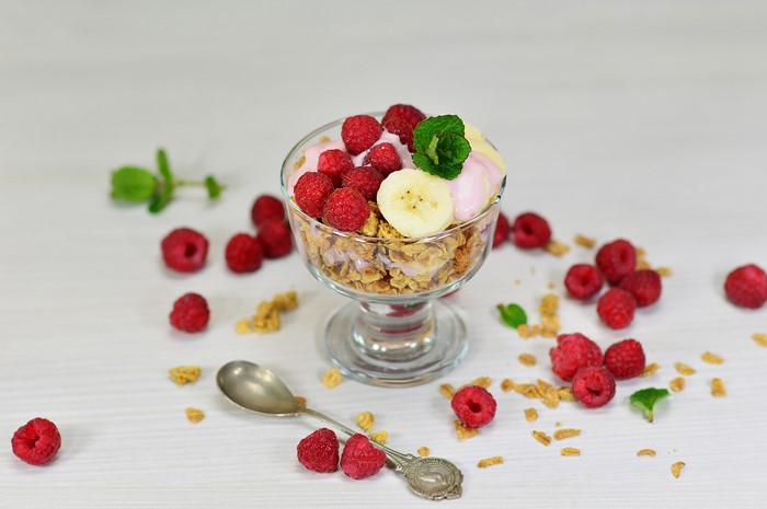 Muesli with Raspberry and Banana in a Glass Bowl