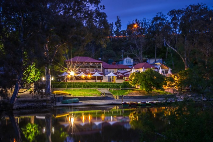 Riverside buildings and boats at night in Melbourne, Australia