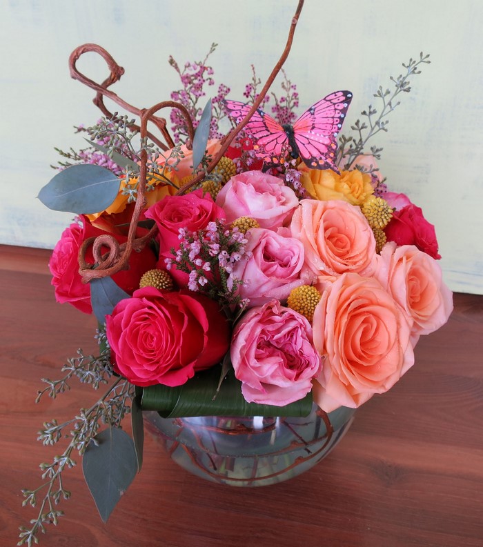 Pink and orange roses bouquet with butterfly