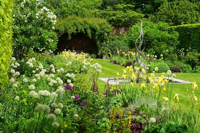 Manor House Gardens England with Fountains and Shrubs