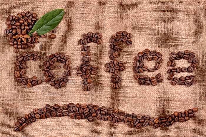 Coffee beans spelling "Coffee" and a smiley face