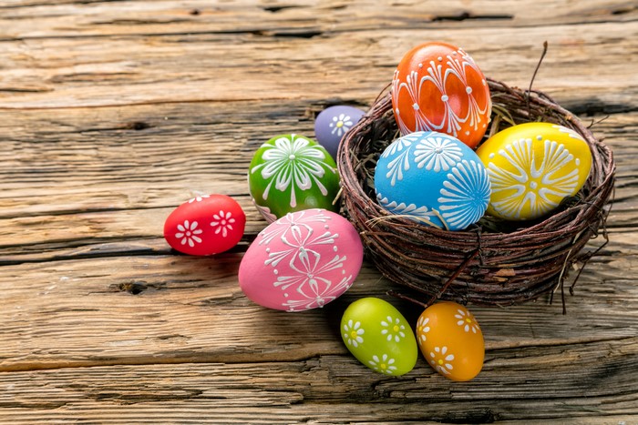 Easter Eggs in a Nest on Wooden Surface