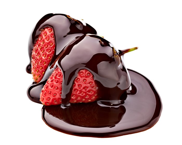 Two strawberries covered in chocolate