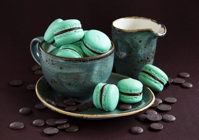 Turquoise Macarons in a Cup with Chocolate